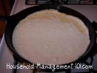 cornbread batter in iron skillet