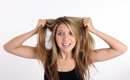 Overwhelmed woman trying to get organized